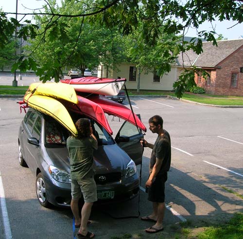 Car loaded up with kayaks Car loaded up with kayaks